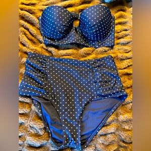 Aerie women’s navy with white polkadot print. Strapless top 36D Lg bottoms.